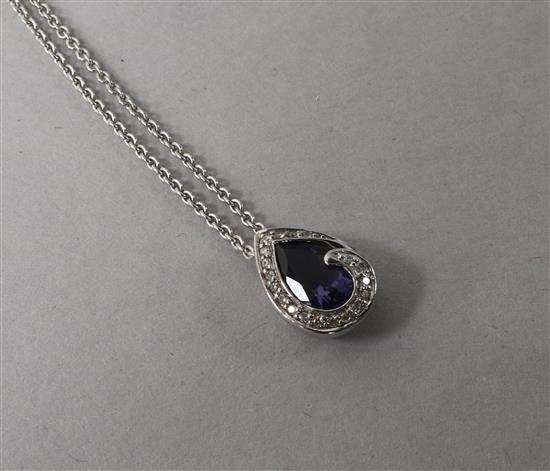 A 9ct white gold, lolite & diamond tear drop pendant on chain.